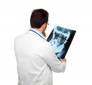 Doctor Consulting A Bowel Radiography