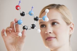 Female Chemist with molecules