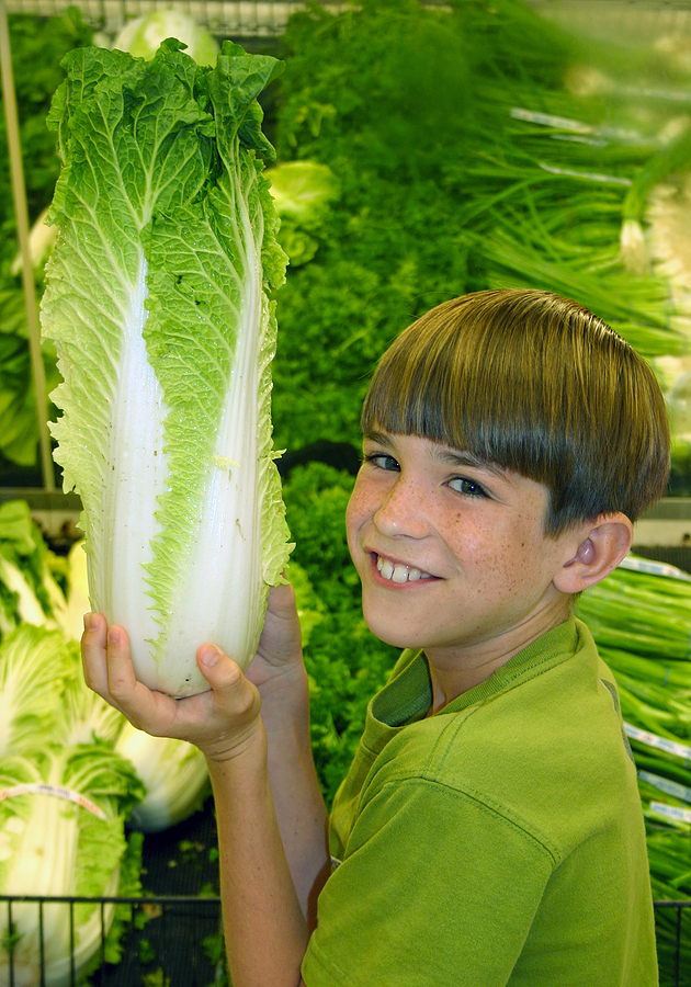 Bigstock_Boy_Holding_up_Produce_782185