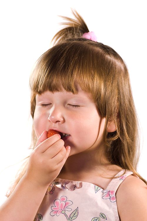 Bigstock_Little_Girl_Tasting_Strawberry_2051251